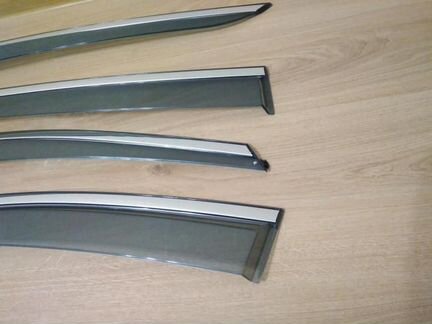 Дефлекторы Toyota Corolla нержавеющий молдинг