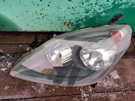 Фара левая для Опель Зафира Б 05-12гг